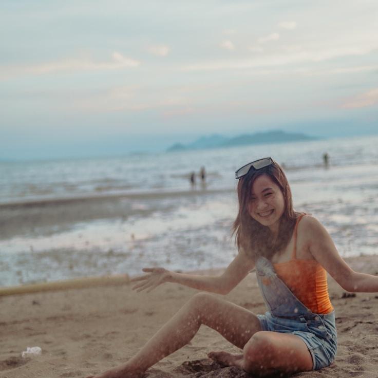 Kaveri Mehta, Lead Design Curator at HarborLinkLabs, reviewing corporate floral arrangements